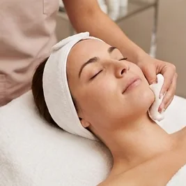 Client being cleansed with a soft pad