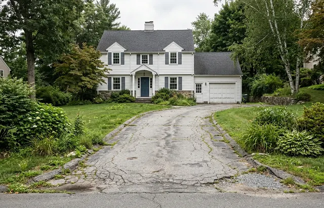 Faded cracked driveway before sealcoating
