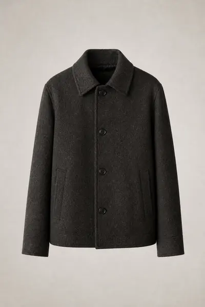 Charcoal pressed wool car coat photographed front on against a pale grey ground