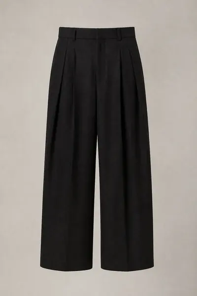 Black wide pleated wool trousers photographed flat on a pale grey ground