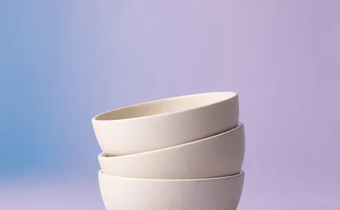 Stacked cream ceramic bowls