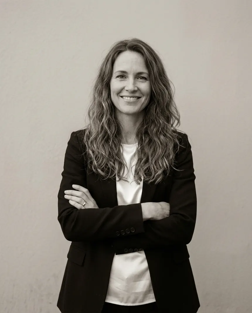 Maren Kessler, arms crossed, in a black blazer