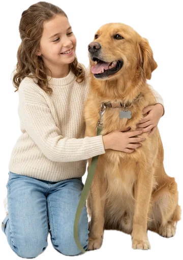 A smiling girl hugging a golden retriever