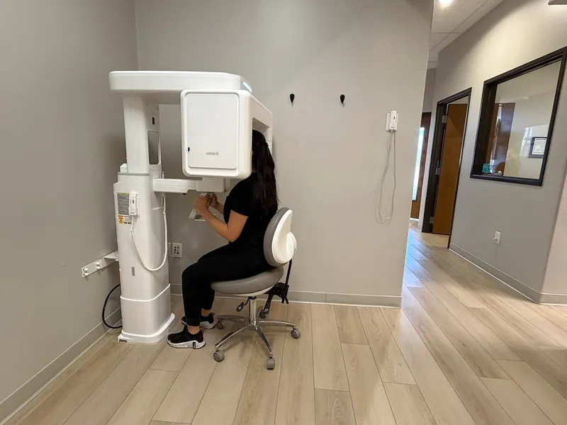 The cone-beam CT machine in the imaging room