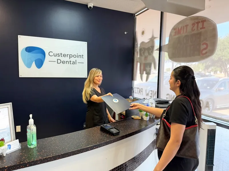 A patient is greeted at the front desk