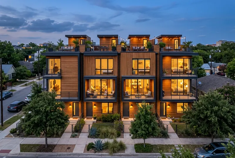 Wood and steel townhomes at dusk