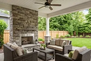 Covered patio with an outdoor fireplace