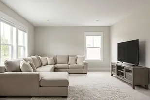 Bonus room with a sofa and television