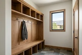 Mudroom with a bench and hooks