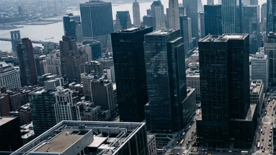City skyline illustrating the software company merger matter