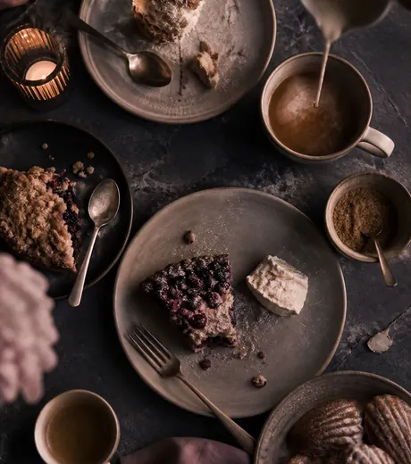 Plates of pastry and cream on the slate dessert counter