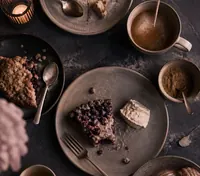 Cups and spoons on a slate counter