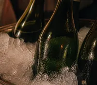 Green bottles set in crushed ice