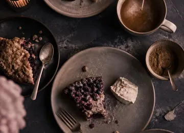 Pastries and espresso cups on the slate dessert counter